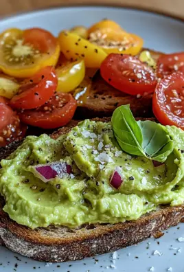 Geröstetes Brot mit Avocadobutter und Tomatensalat
